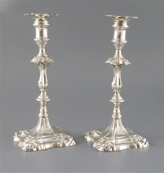 A pair of early George III cast silver candlesticks by Ebenezer Coker, 37.5oz.